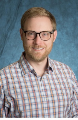 Portrait of Adam Williams.